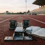 Smartphone and stopwatch on a starting block, for the Dicey review