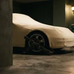 Covered sports car with a wheel clamp on its wheel, illustrating the Izzi Casino review