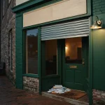 Half-reopened storefront with unopened mail on the mat, illustrating the JacksPay review