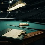 Folder of bank statements on the rail of a championship pool table, illustrating the Roobet review
