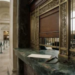 Bank teller window with a half-lowered shutter and a withdrawal slip, echoing the Vavada review